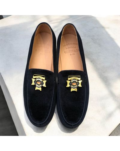 Moccasin Center 51 14569 black velvet with a gold-tone metal medallion