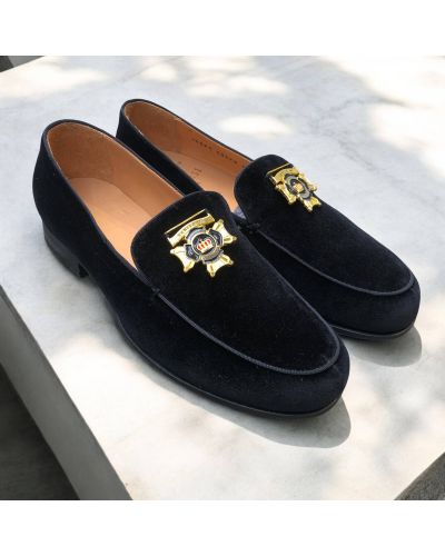 Moccasin Center 51 14569 black velvet with a gold-tone metal medallion